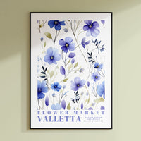 a blue flower market poster hanging on a wall
