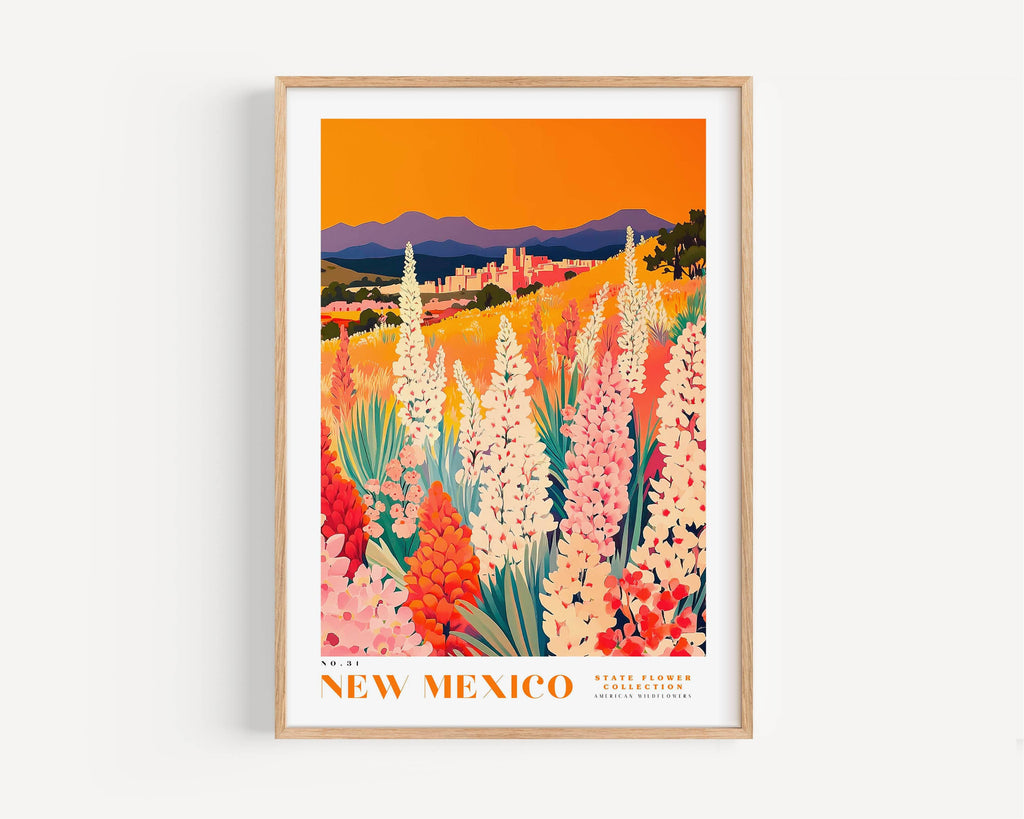 The image is a framed poster depicting a vibrant landscape with a field of colorful flowers, mountains in the background, and a warm orange sky.