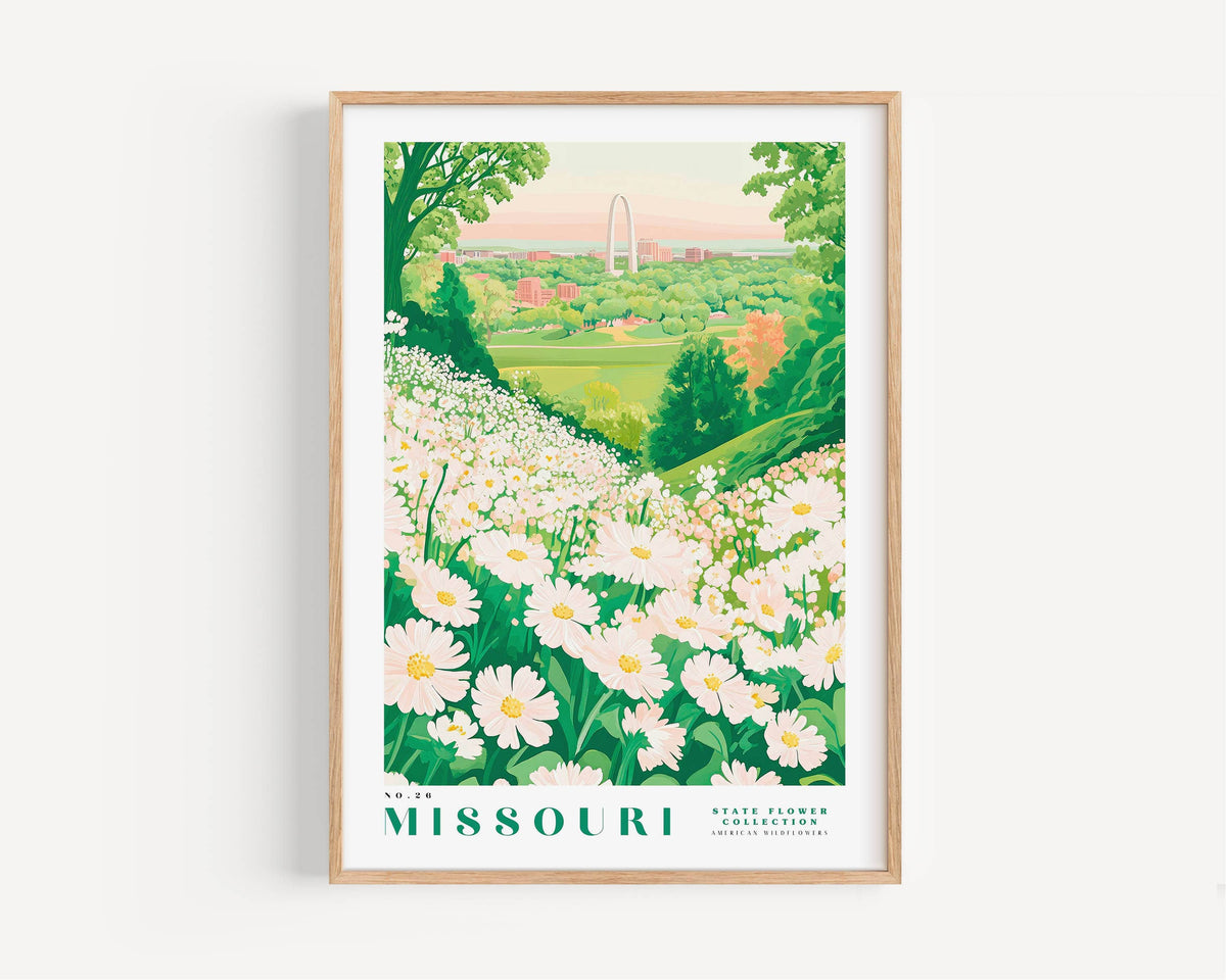 A framed poster depicting a scenic view of a flower garden in Missouri, with a large arch in the distance.