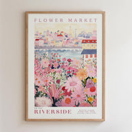The image is a framed poster depicting a vibrant and colorful flower market scene with a cityscape in the background.