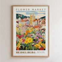The image is a framed poster depicting a colorful and vibrant flower market in Heidelberg, Germany.