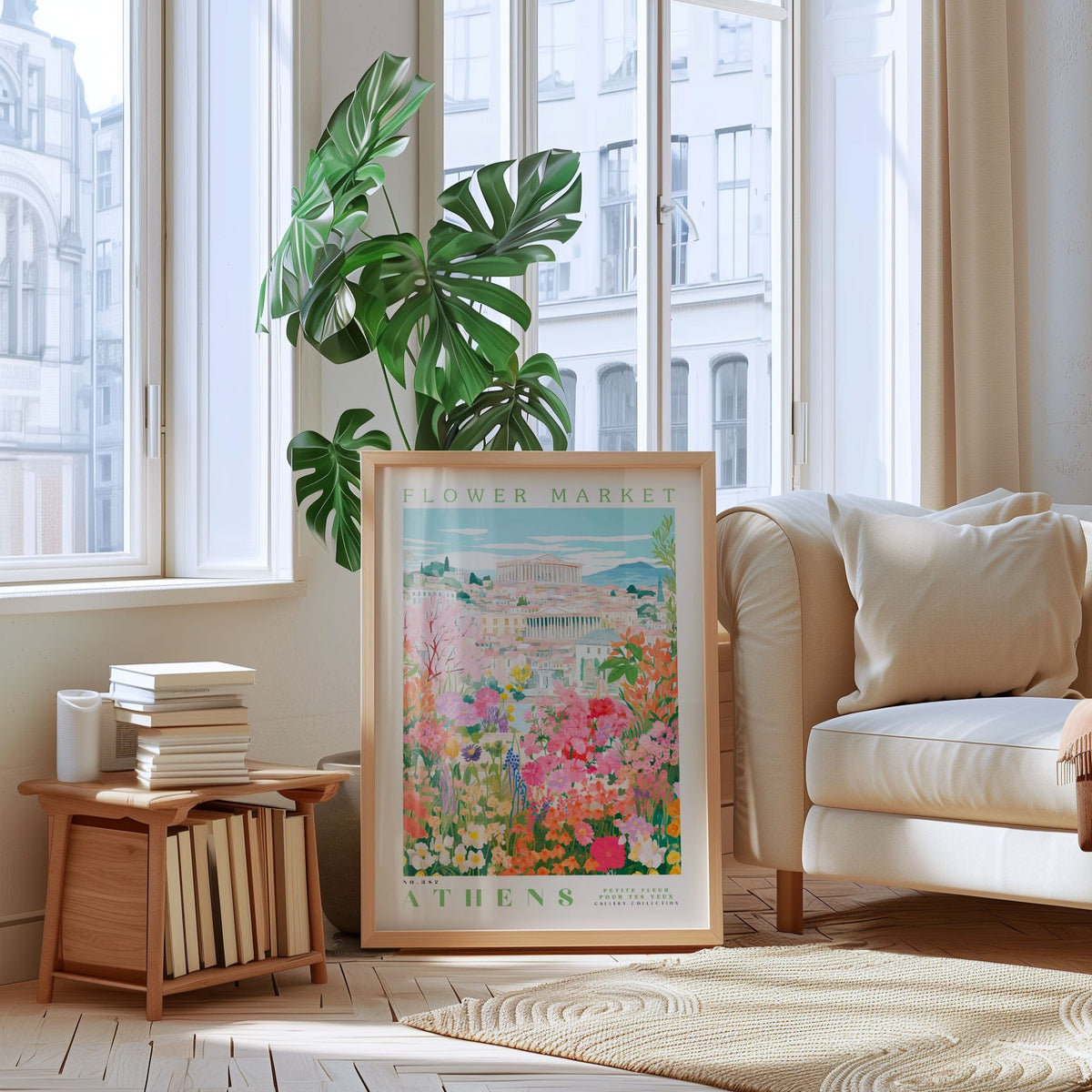 a large framed poster of a flower market in Athens, with a potted plant and bookshelf in the foreground.