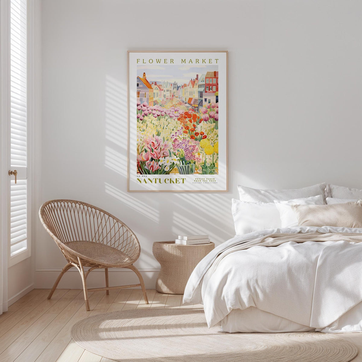 a bedroom with a bed, a woven chair, and a framed poster of a flower market in the background.