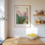 a kitchen counter with a bowl of lemons, a framed poster of Yosemite National Park, and a shelf with jars and bottles.
