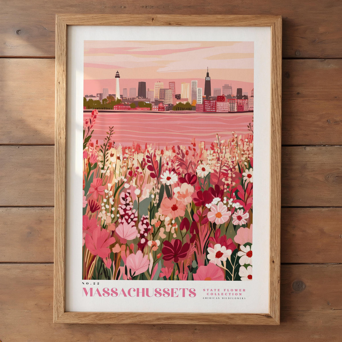 A framed illustration of a cityscape with a pink and green floral field in the foreground, depicting a state flower, the Massachusetts state flower, and a body of water.