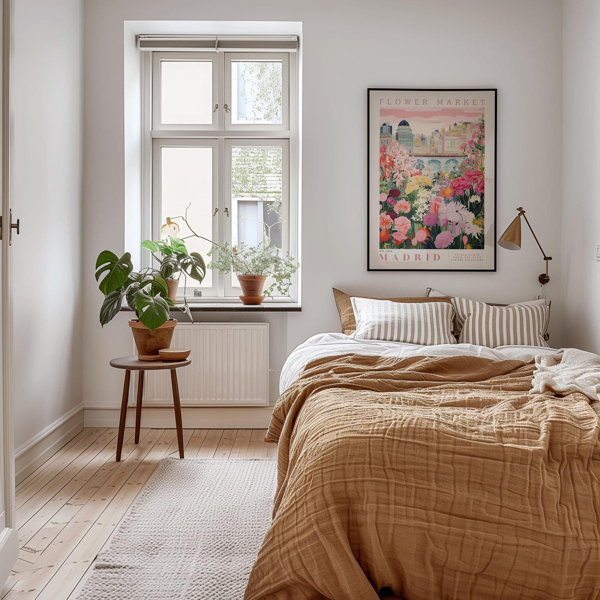 a cozy bedroom with a large bed, a nightstand with a potted plant, and a framed poster of a cityscape on the wall.