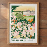 A framed illustration of a scenic landscape with a large building surrounded by a lush garden filled with colorful flowers.