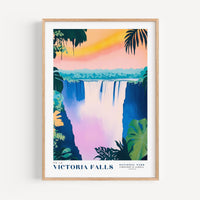 The image is a framed poster depicting the Victoria Falls, a famous waterfall located in Zimbabwe. The poster features a colorful illustration of the waterfall surrounded by lush vegetation and a vibrant sunset sky.