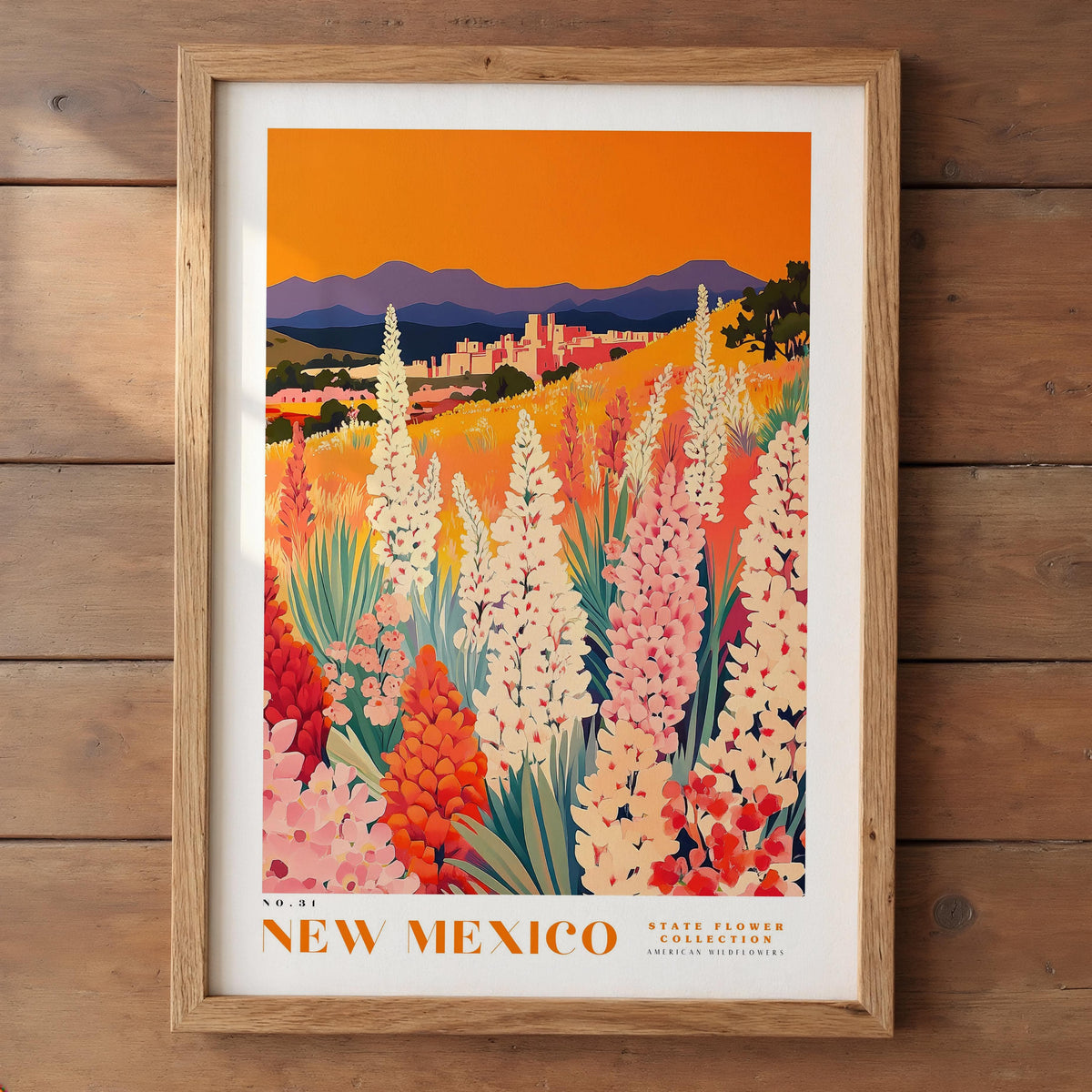 The image is a framed poster depicting a vibrant landscape of flowers in New Mexico, with mountains in the background.