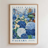 The image is a framed poster depicting a vibrant flower market in Calgary, Canada.