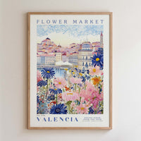 The image is a framed poster depicting a colorful and vibrant scene of a flower market in Valencia, Spain.
