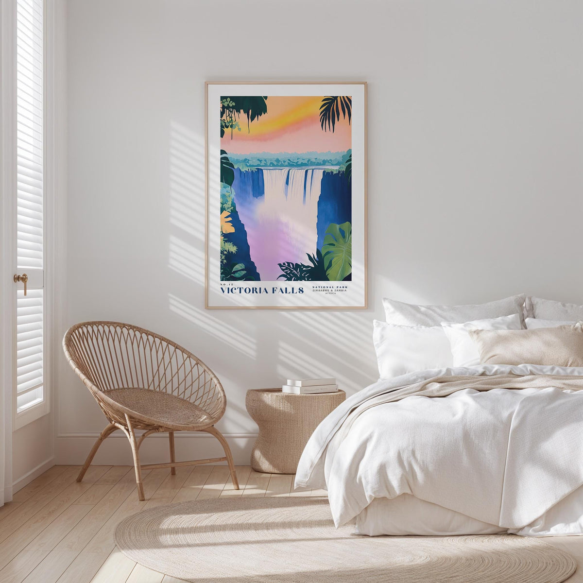 a bedroom with a large poster of Victoria Falls hanging on the wall, a woven chair, and a white bed with a beige blanket.