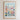 The image is a framed poster depicting a vibrant and colorful flower market in San Antonio, Texas.