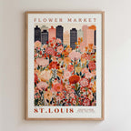 The image is a framed poster depicting a cityscape with a large field of colorful flowers in the foreground.