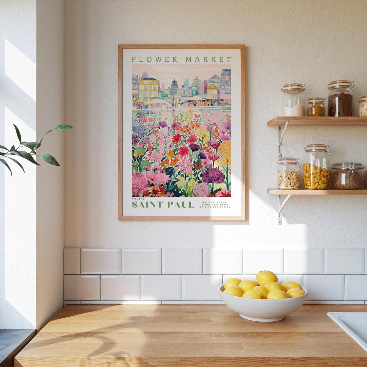 a framed poster of a flower market in Saint Paul, with a wooden shelf below it holding various jars and containers.