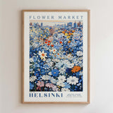 The image is a framed poster depicting a vibrant flower market in Helsinki, Finland.
