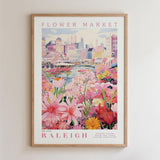A framed poster depicting a vibrant and colorful flower market in Raleigh, North Carolina.