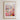 A framed poster depicting a vibrant and colorful flower market in Raleigh, North Carolina.