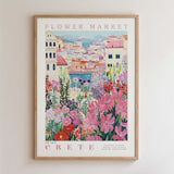The image is a framed poster depicting a vibrant and colorful flower market in Crete, Greece.