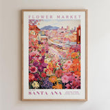 The image is a framed poster depicting a vibrant and colorful cityscape with a variety of flowers in the foreground.