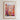 The image is a framed poster depicting a vibrant and colorful cityscape with a variety of flowers in the foreground.