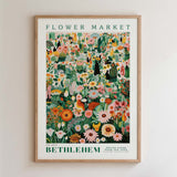 The image is a framed poster depicting a vibrant and colorful floral market scene.