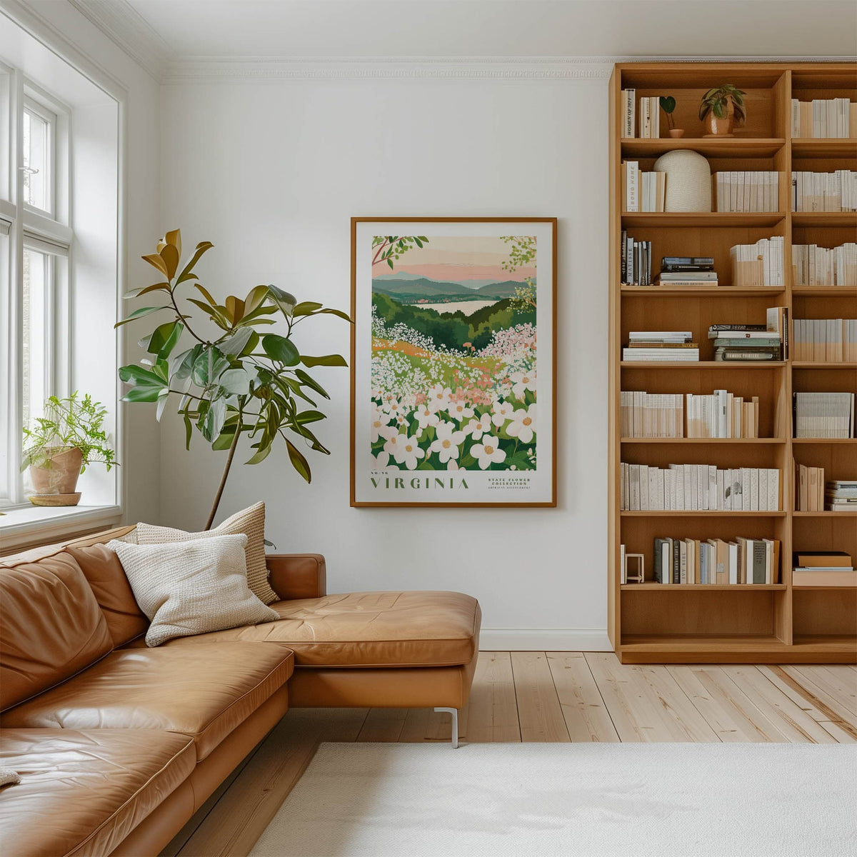 a cozy living room with a large window, a comfortable leather sofa, a wooden bookshelf filled with books, and a framed poster of a flowery landscape hanging on the wall.