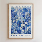The image is a framed poster of a floral design with the text "FLOWER MARKET TOKYO" and "PETITE FLUER POUR TES FEUMS GALLERY COLLECTION" printed on it.