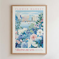 The image is a framed poster depicting a vibrant flower market in Virginia Beach, with a cityscape in the background.