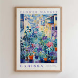 The image is a framed poster depicting a colorful and vibrant flower market scene.