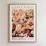 The image is a framed poster of a flower market in Shanghai, featuring a vibrant and colorful illustration of various flowers and foliage.