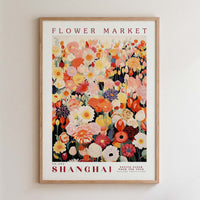 The image is a framed poster of a flower market in Shanghai, featuring a vibrant and colorful illustration of various flowers and foliage.
