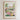 The image is a framed poster depicting a vibrant flower market in FERNANDINA BEACH, with colorful flowers, plants, and a picturesque town in the background.