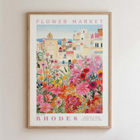 The image is a framed poster depicting a vibrant and colorful flower market in Rhodes, Greece.