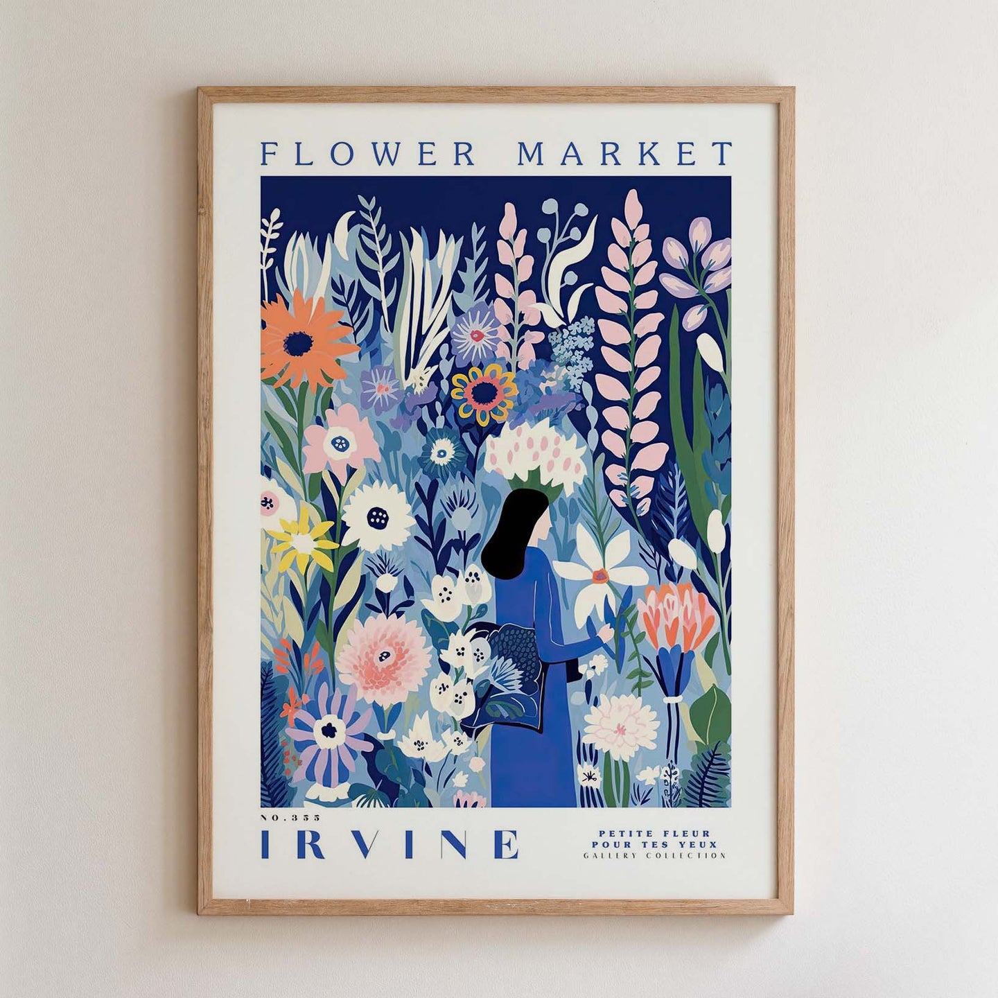 The image is a framed poster advertising a flower market. It features a woman standing amidst a colorful array of flowers and plants, with the text "FLOWER MARKET" prominently displayed.