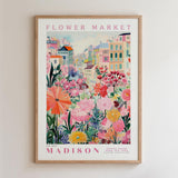A framed poster depicting a vibrant and colorful flower market in Madison, Wisconsin.