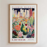 The image is a framed poster depicting a vibrant and colorful flower market in Las Vegas, with a cityscape in the background.