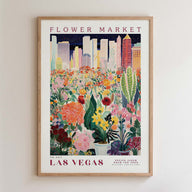 The image is a framed poster depicting a vibrant and colorful flower market in Las Vegas, with a cityscape in the background.