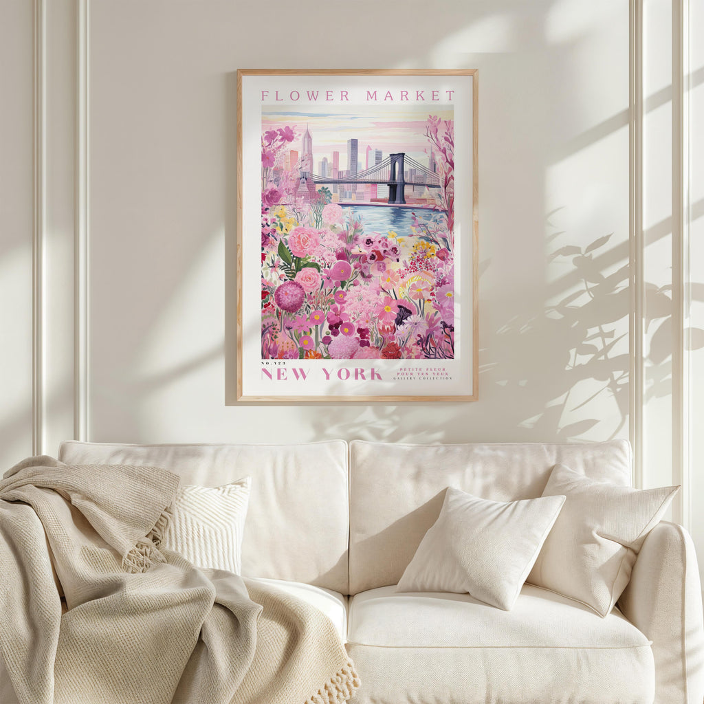 a framed poster of a flower market in New York, with a bridge and flowers in the background.