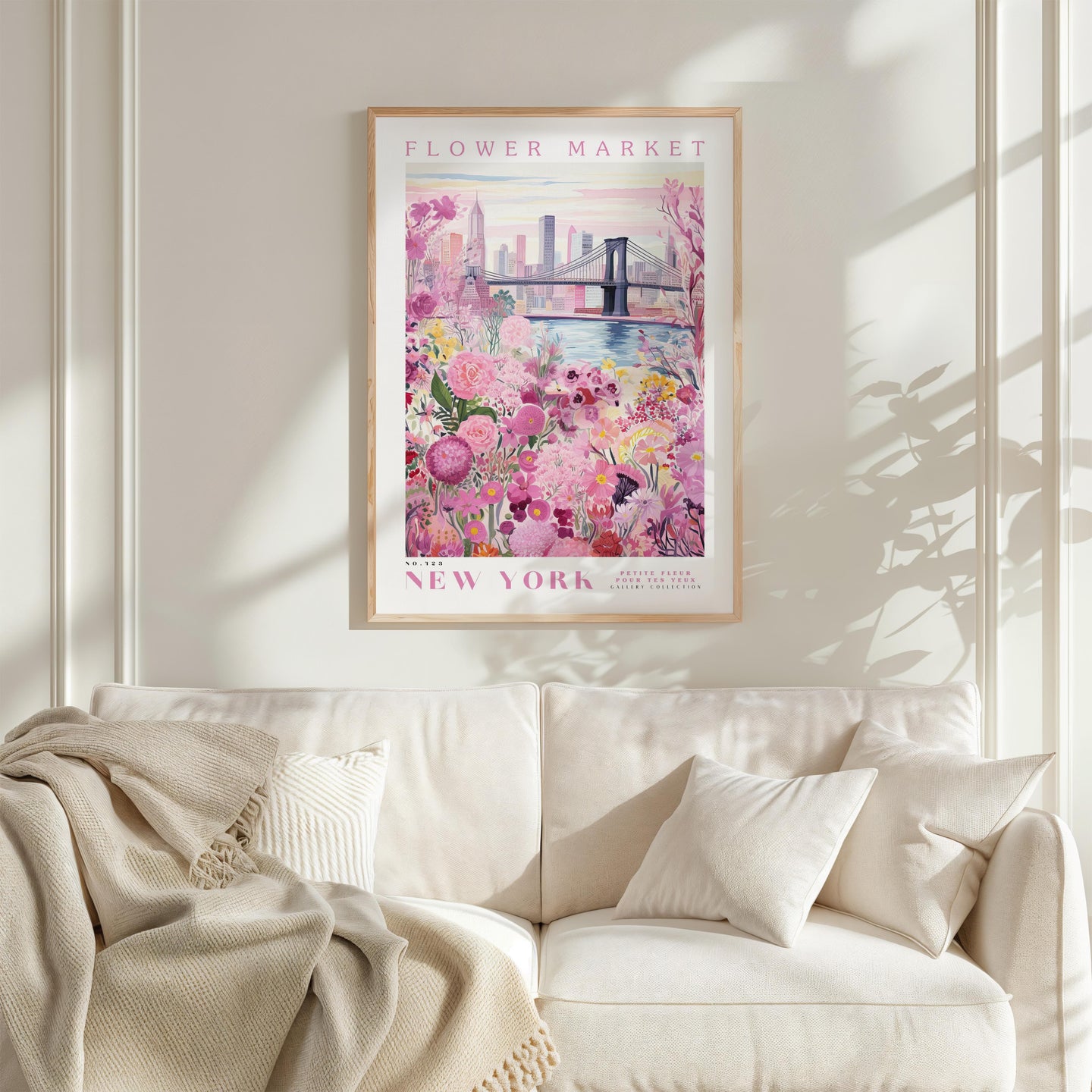a framed poster of a flower market in New York, with a bridge and flowers in the background.