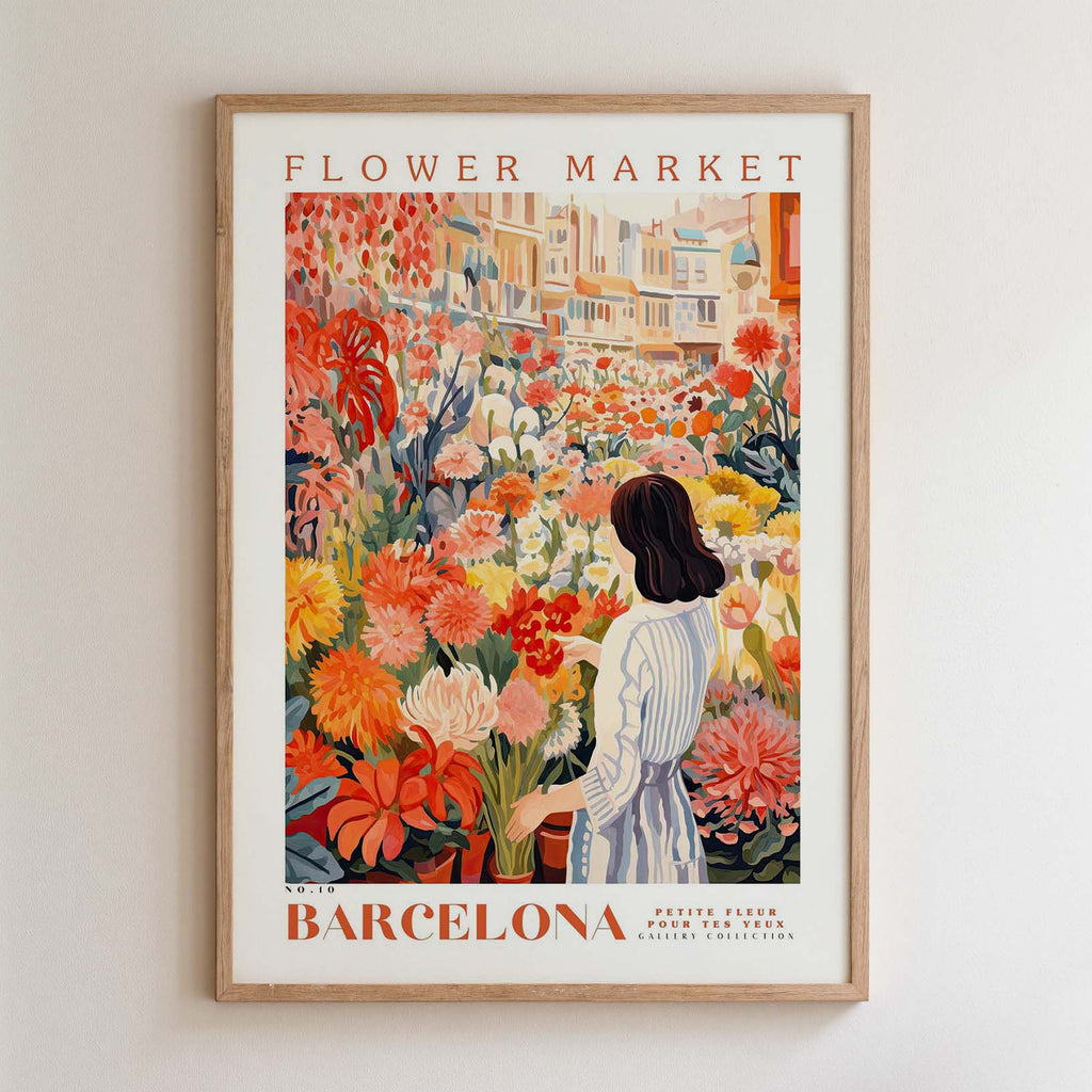 The image is a framed poster depicting a woman standing in a flower market in Barcelona, surrounded by a variety of colorful flowers.