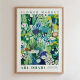 The image is a framed poster depicting a vibrant and colorful floral scene, with various flowers and plants in shades of green, blue, and yellow.