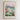 The image is a framed poster depicting a cityscape with a flower market in the foreground.