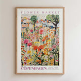The image is a framed poster depicting a vibrant and colorful flower market in Copenhagen, Denmark.