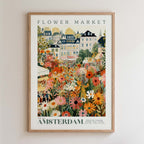 The image is a framed poster depicting a vibrant flower market in Amsterdam, with colorful flowers and buildings in the background.