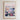 The image is a framed poster depicting a cityscape with a flower market in the background.