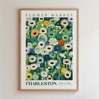 The image is a framed poster of a flower market in Charleston, featuring a variety of colorful flowers and plants.
