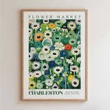 The image is a framed poster of a flower market in Charleston, featuring a variety of colorful flowers and plants.