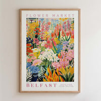 The image is a framed poster of a flower market in Belfast, UK.
