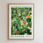 The image is a framed poster depicting a lush, colorful garden scene with various flowers, plants, and foliage.